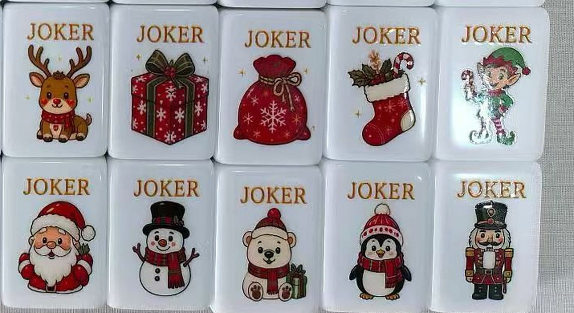 Ten Christmas Joker tiles: reindeer, gift box, Santa's sack, stocking, elf, Santa, snowman, polar bear, penguin and nutcracker