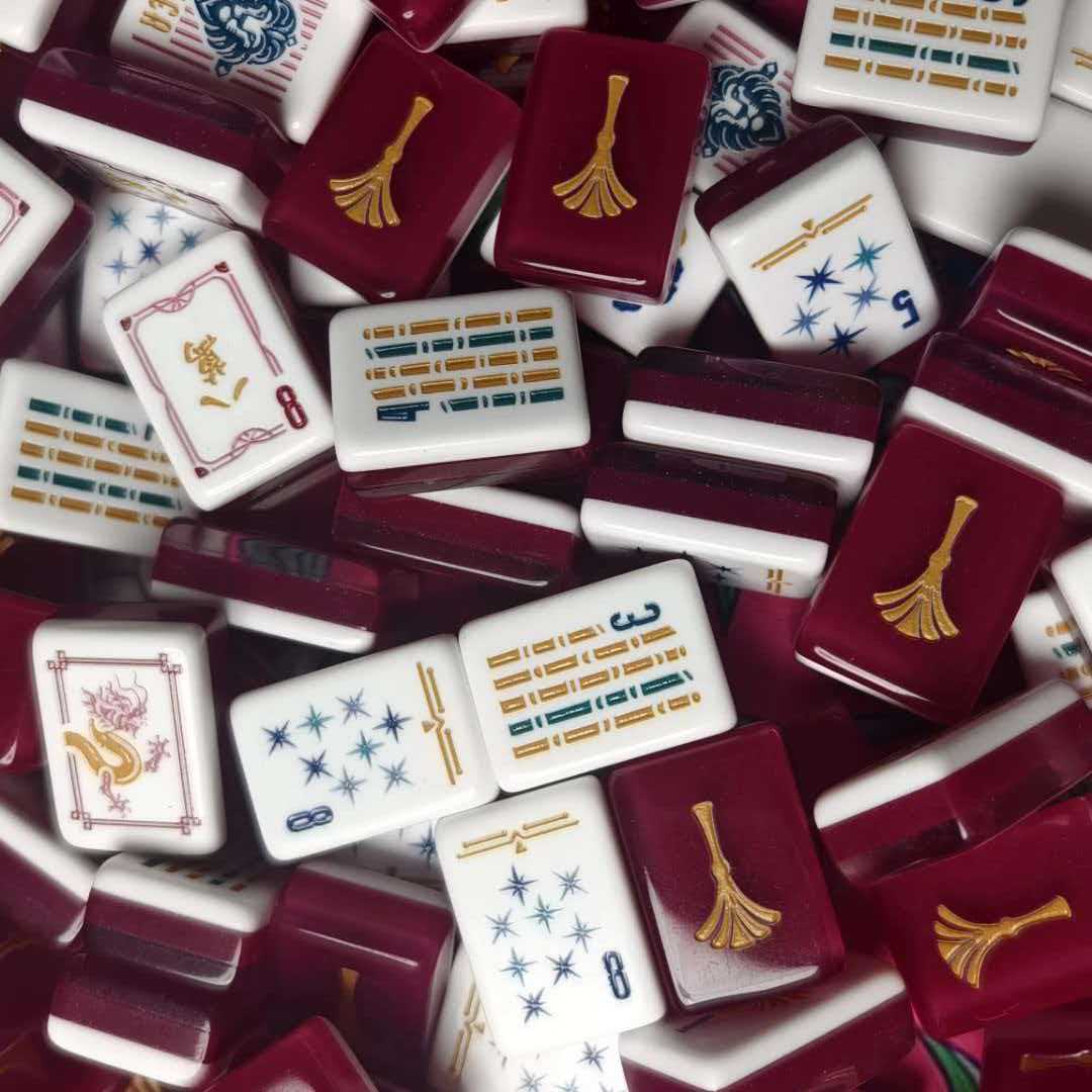Red Sheffield American mahjong tiles with burgundy backs, gold fan motifs, white faces and blue star patterns