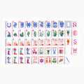 White Farm American mahjong tiles with white faces, horseshoes, green cacti, sunrise patterns and floral cowboy boots